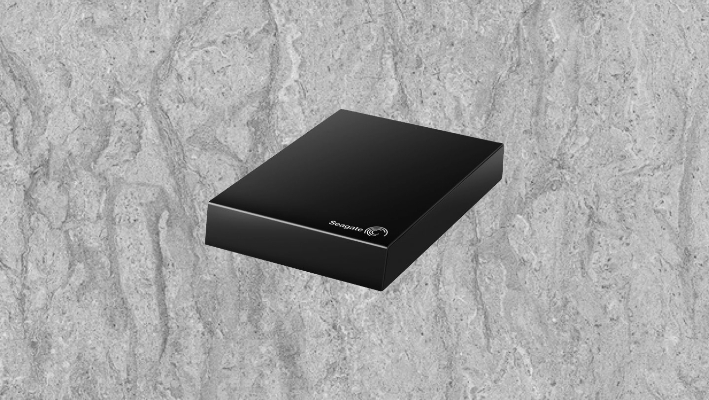 How should external hard drives and flash drives be stored?